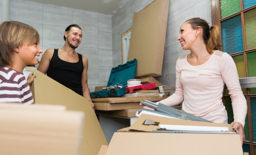 Student removals team handling boxes near a Croydon flat share