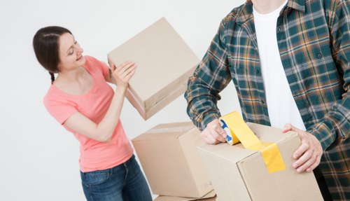 Removal team handling furniture for a flat move in Croydon