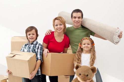 Packed moving boxes and furniture ready for transport in Croydon