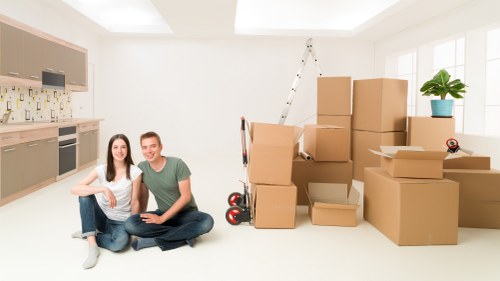 Loading furniture into a moving truck in a Croydon street