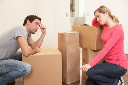 Staff using PPE while handling furniture during a move